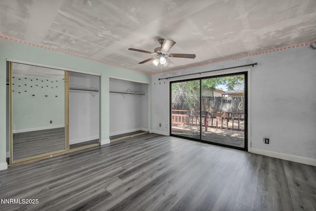 650 E York Way, Sparks, NV 89431 - unfurnished bedroom featuring access to outside, two closets, wood finished floors, and ceiling fan