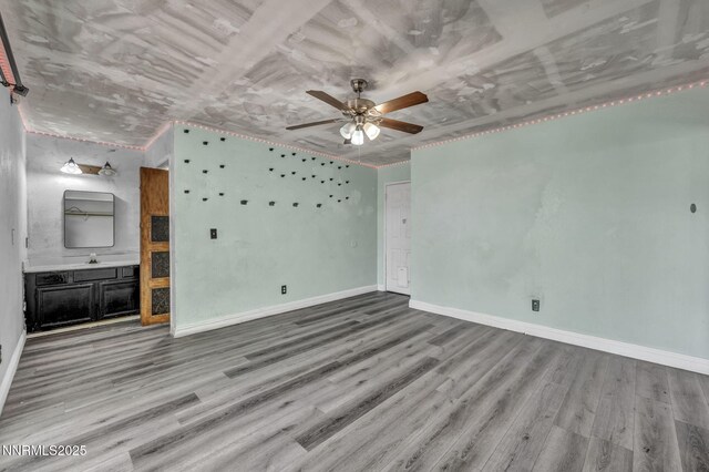 650 E York Way, Sparks, NV 89431 - unfurnished living room featuring wood finished floors and a ceiling fan