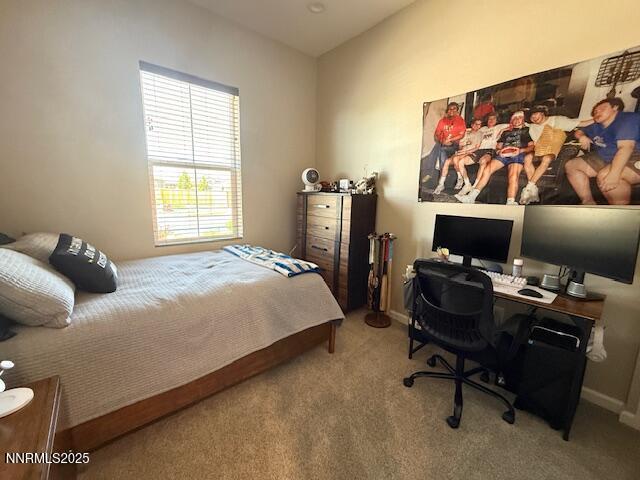 7800 Hoback Dr, Sparks, NV 89436 - carpeted bedroom featuring a desk and baseboards