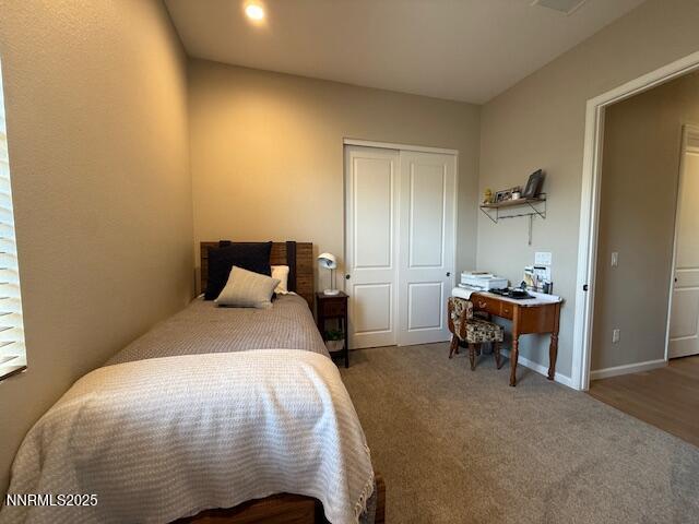 7800 Hoback Dr, Sparks, NV 89436 - bedroom featuring a closet, carpet, and a desk