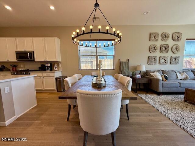 7800 Hoback Dr, Sparks, NV 89436 - dining area with a chandelier, light wood-style floors, and recessed lighting