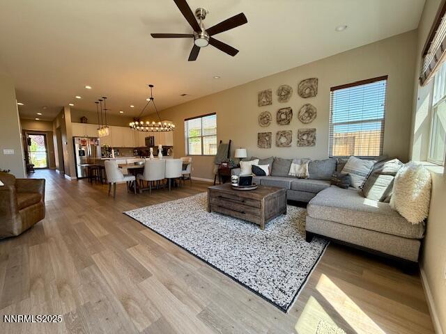 7800 Hoback Dr, Sparks, NV 89436 - living room featuring a ceiling fan, light wood-style floors, a chandelier, recessed lighting, and baseboards