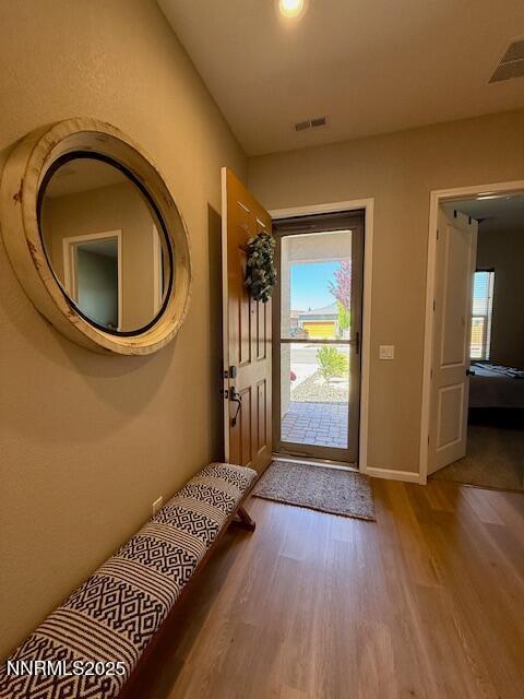 7800 Hoback Dr, Sparks, NV 89436 - foyer entrance with wood finished floors, healthy amount of natural light, and baseboards