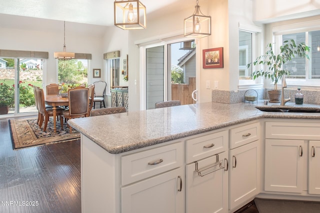 2061 Mountain Vista Way, Reno, NV 89519 - kitchen with healthy amount of natural light, white cabinets, and dark wood-style floors