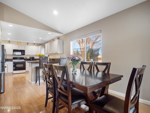 733 Bowles Ln, Gardnerville, NV 89460 - dining area featuring vaulted ceiling, light wood-type flooring, recessed lighting, and baseboards