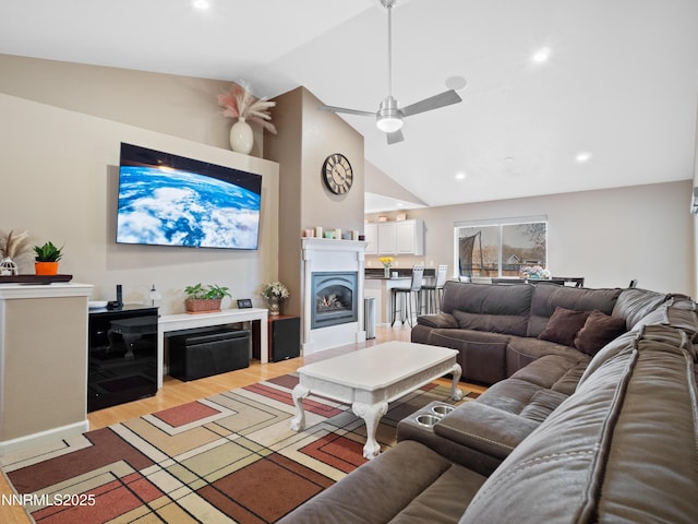 733 Bowles Ln, Gardnerville, NV 89460 - living room with ceiling fan, light wood-type flooring, a lit fireplace, high vaulted ceiling, and recessed lighting