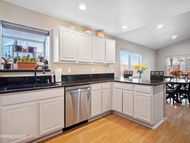 733 Bowles Ln, Gardnerville, NV 89460 - kitchen with dishwasher, a sink, light wood-type flooring, white cabinets, and a peninsula