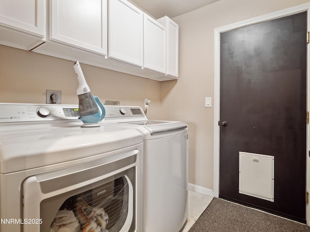 733 Bowles Ln, Gardnerville, NV 89460 - laundry area with washing machine and clothes dryer, cabinet space, baseboards, and light tile patterned floors