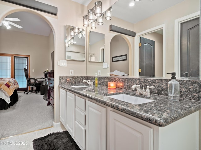 733 Bowles Ln, Gardnerville, NV 89460 - ensuite bathroom featuring double vanity, a ceiling fan, and tile patterned floors