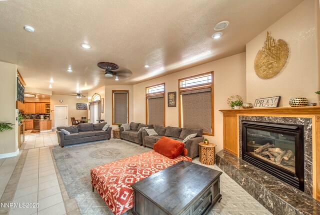 6752 Eagle Wing Cir, Sparks, NV 89436 - living area featuring light tile patterned floors, a fireplace, recessed lighting, and a textured ceiling