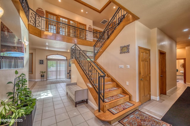 6752 Eagle Wing Cir, Sparks, NV 89436 - stairway with tile patterned flooring, recessed lighting, and a towering ceiling