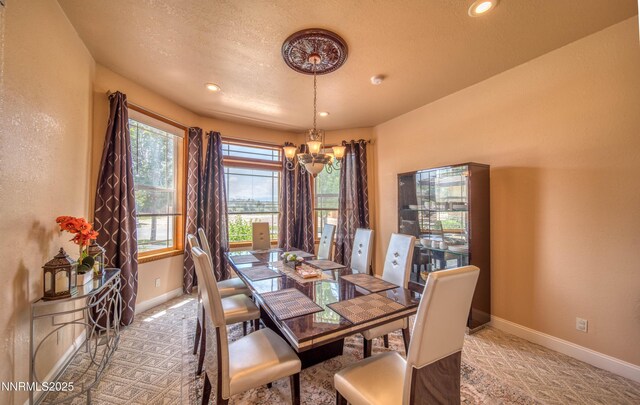 6752 Eagle Wing Cir, Sparks, NV 89436 - dining room featuring a chandelier, light carpet, recessed lighting, and a textured ceiling