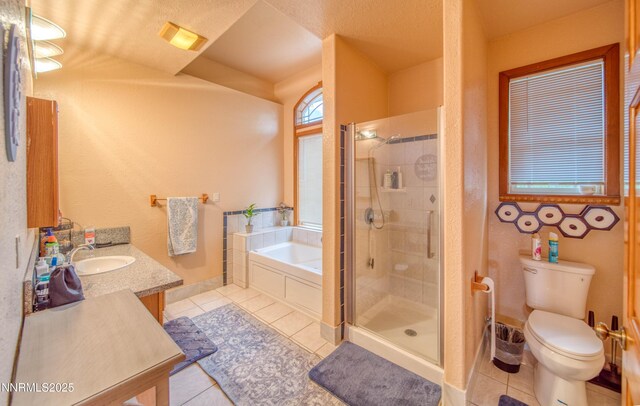 6752 Eagle Wing Cir, Sparks, NV 89436 - full bath with tile patterned floors, a bath, a shower stall, and vanity