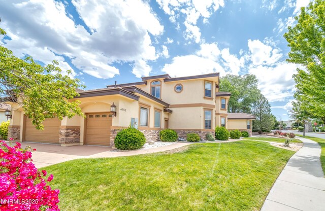 6752 Eagle Wing Cir, Sparks, NV 89436 - mediterranean / spanish house featuring stone siding, stucco siding, driveway, a front lawn, and a garage