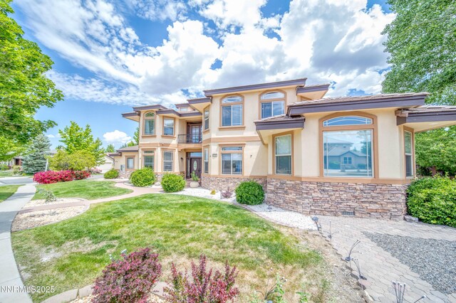 6752 Eagle Wing Cir, Sparks, NV 89436 - view of front of property featuring stucco siding, stone siding, and a front lawn