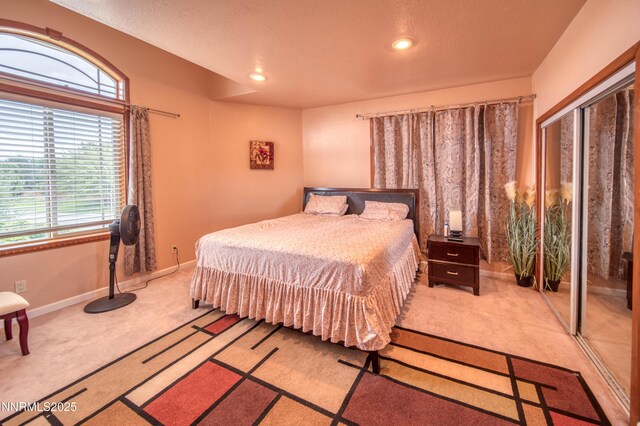 6752 Eagle Wing Cir, Sparks, NV 89436 - bedroom featuring light colored carpet, multiple windows, and recessed lighting