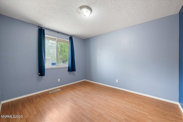 3830 Avocet Ct, Reno, NV 89508 - unfurnished room with wood finished floors and a textured ceiling