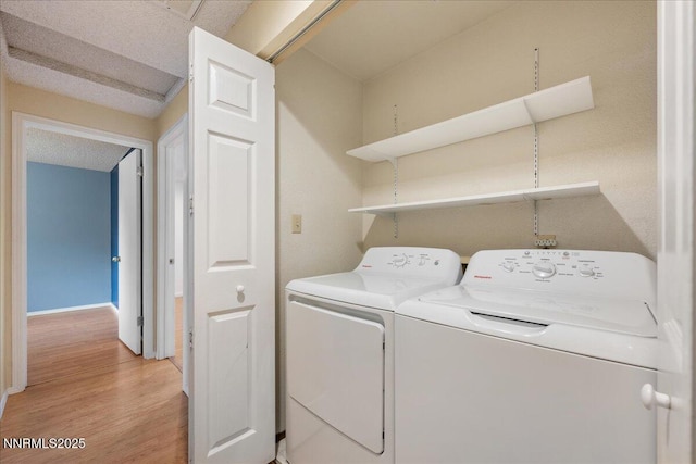 3830 Avocet Ct, Reno, NV 89508 - washroom with washing machine and clothes dryer and light wood-style flooring
