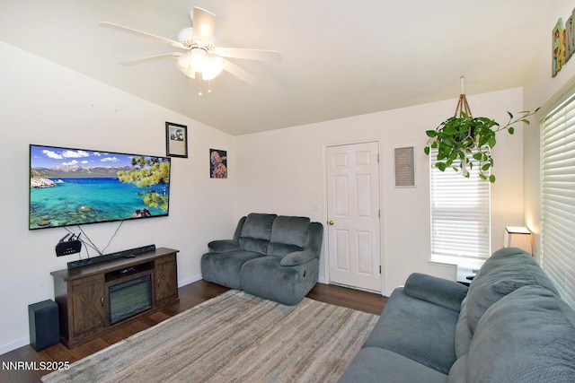 17711 Casita Ct, Reno, NV 89508 - living area with vaulted ceiling, wood finished floors, ceiling fan, and baseboards