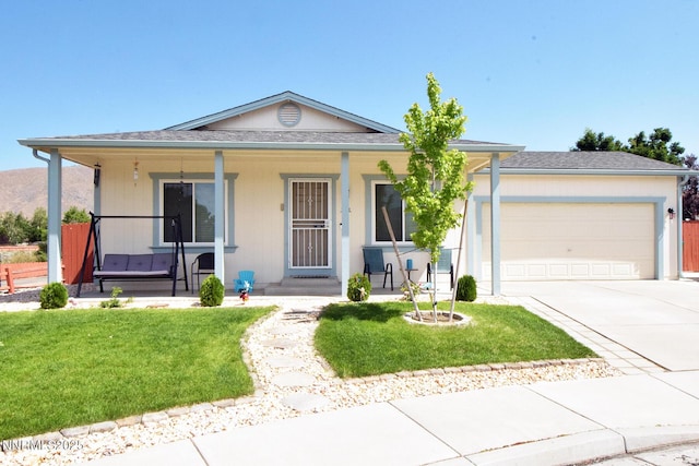17711 Casita Ct, Reno, NV 89508 - ranch-style home with a porch, driveway, a garage, and a front lawn