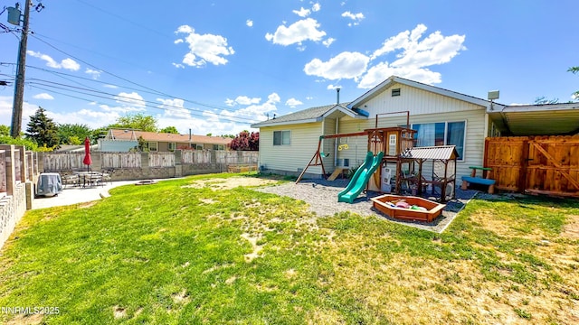241 W National Ave, Winnemucca, NV 89445 - rear view of property with a playground and a patio