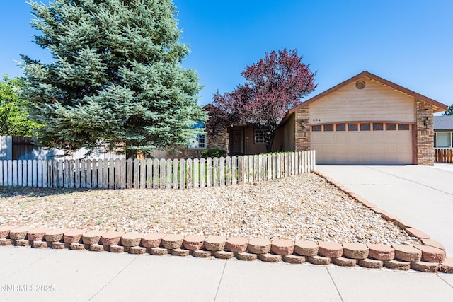 804 Bluerock Rd, Gardnerville, NV 89460 - view of front of house featuring a garage, concrete driveway, and a fenced front yard