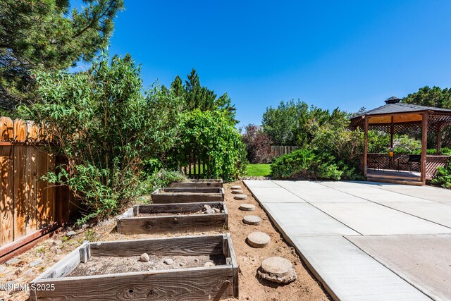 804 Bluerock Rd, Gardnerville, NV 89460 - fenced backyard featuring a gazebo, a garden, and a patio