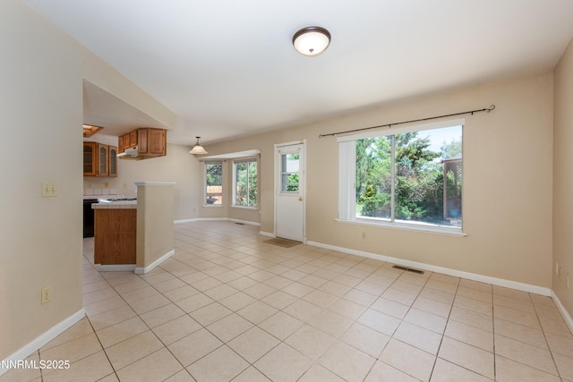 804 Bluerock Rd, Gardnerville, NV 89460 - unfurnished living room with light tile patterned floors and baseboards