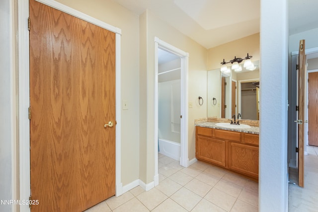804 Bluerock Rd, Gardnerville, NV 89460 - bathroom with tile patterned floors, vanity, a tub to relax in, and a closet