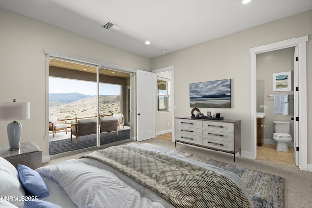 2241 Cold Creek Trl, Reno, NV 89523 - bedroom featuring access to outside, a mountain view, light colored carpet, recessed lighting, and ensuite bath
