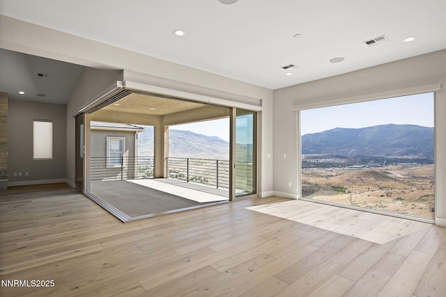 2241 Cold Creek Trl, Reno, NV 89523 - spare room featuring a mountain view, wood finished floors, and recessed lighting