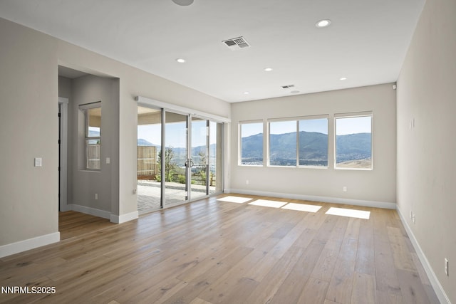 2241 Cold Creek Trl, Reno, NV 89523 - spare room featuring a mountain view, light wood-type flooring, and recessed lighting