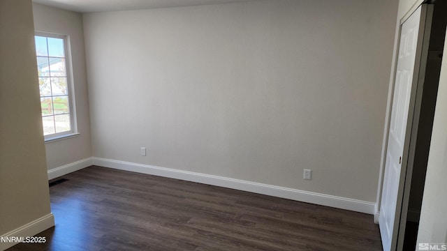 5910 Poinsettia Ct, Sun Valley, NV 89433 - empty room featuring dark wood-style floors and baseboards