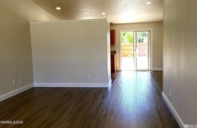 5910 Poinsettia Ct, Sun Valley, NV 89433 - empty room with dark wood-style flooring, baseboards, and recessed lighting