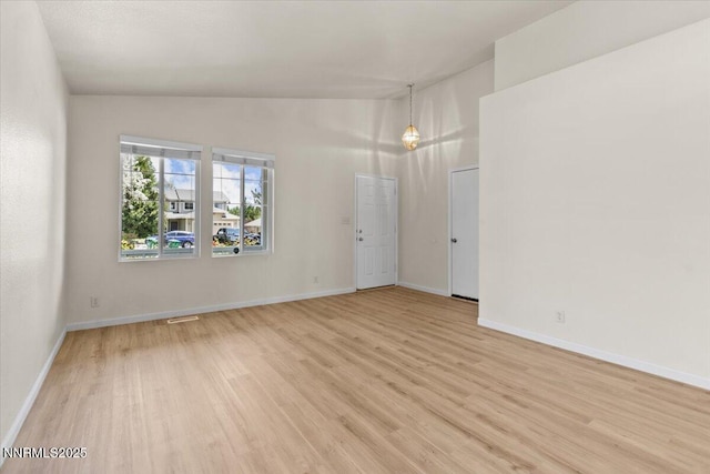 7250 Timber Ridge Ct, Reno, NV 89523 - spare room with light wood-style floors and high vaulted ceiling
