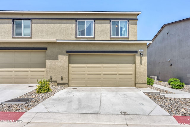 529 Autumn Breeze Cir, Reno, NV 89511 - view of property with stucco siding, a garage, and concrete driveway