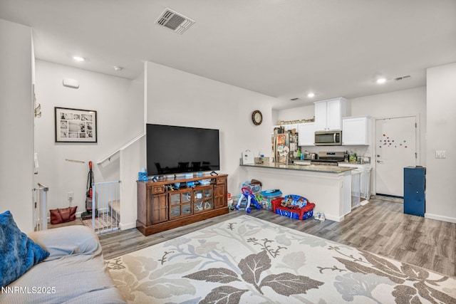 529 Autumn Breeze Cir, Reno, NV 89511 - living room with light wood-style flooring, recessed lighting, and baseboards