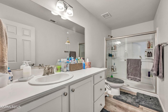 529 Autumn Breeze Cir, Reno, NV 89511 - bathroom featuring vanity, a shower stall, toilet, and wood finished floors