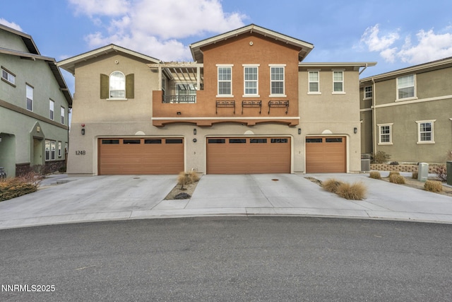 1248 Cinch Trl Unit 3, Gardnerville, NV 89410 - view of front of house with stucco siding, driveway, and an attached garage