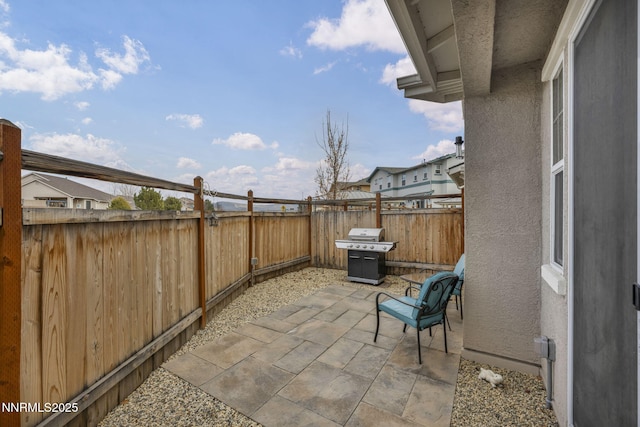 1248 Cinch Trl Unit 3, Gardnerville, NV 89410 - fenced backyard featuring a grill and a patio area