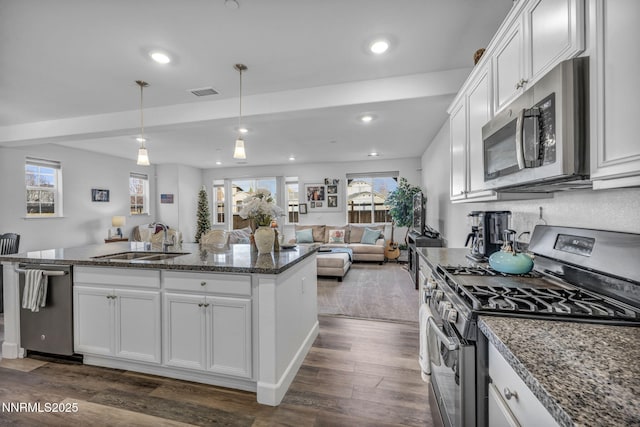 1248 Cinch Trl Unit 3, Gardnerville, NV 89410 - kitchen featuring appliances with stainless steel finishes, dark wood-type flooring, white cabinetry, and recessed lighting