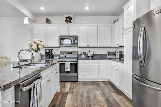 1248 Cinch Trl Unit 3, Gardnerville, NV 89410 - kitchen featuring stainless steel appliances, white cabinets, dark wood finished floors, decorative light fixtures, and recessed lighting