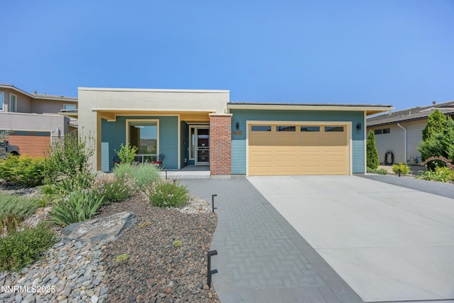 4697 High Pass Ct, Sparks, NV 89436 - view of front of house featuring a garage, driveway, and covered porch