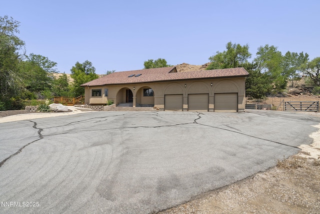 430 E Queen Way, Sparks, NV 89431 - view of front of property featuring a garage, stucco siding, a porch, and driveway