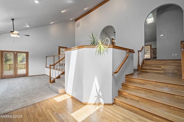 430 E Queen Way, Sparks, NV 89431 - stairway featuring arched walkways, ceiling fan, high vaulted ceiling, wood finished floors, and baseboards