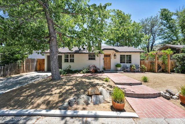 705 Elm St, Carson City, NV 89703 - ranch-style house featuring stucco siding and concrete driveway