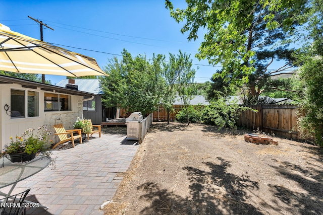 705 Elm St, Carson City, NV 89703 - fenced backyard with a patio