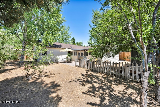 705 Elm St, Carson City, NV 89703 - rear view of house with a patio