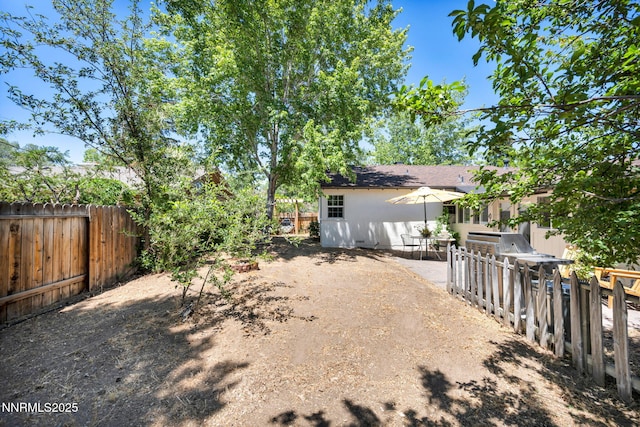 705 Elm St, Carson City, NV 89703 - fenced backyard featuring a patio