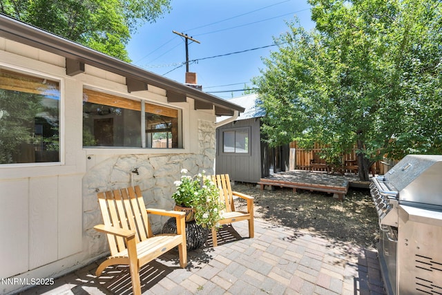 705 Elm St, Carson City, NV 89703 - view of patio with area for grilling and a wooden deck